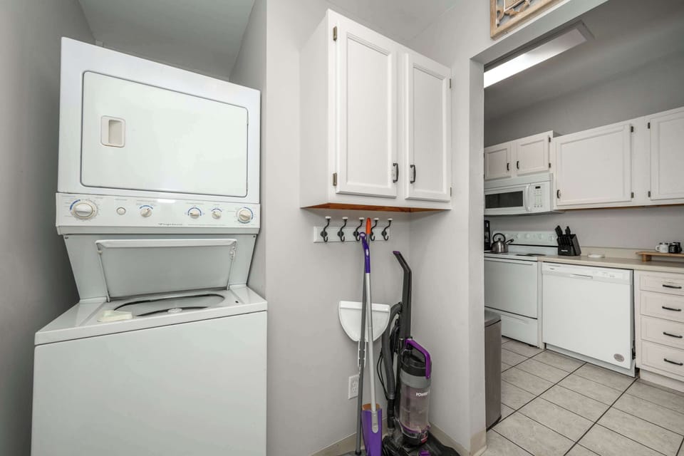 Private laundry is available for your stay, tucked away off the kitchen