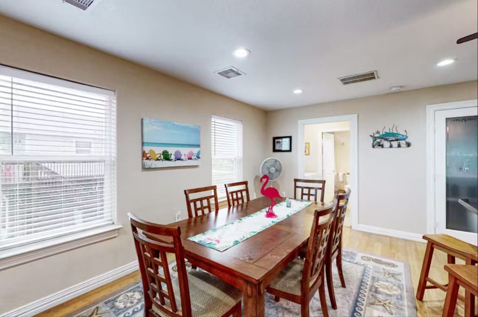 Charming, spacious dining room perfect for meals with loved ones—extra seats too
