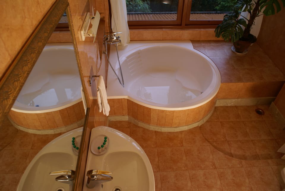 Royal Suite, 1 King Bed, Bathtub, Valley View | Bathroom | Combined shower/tub, free toiletries, hair dryer (on request), slippers