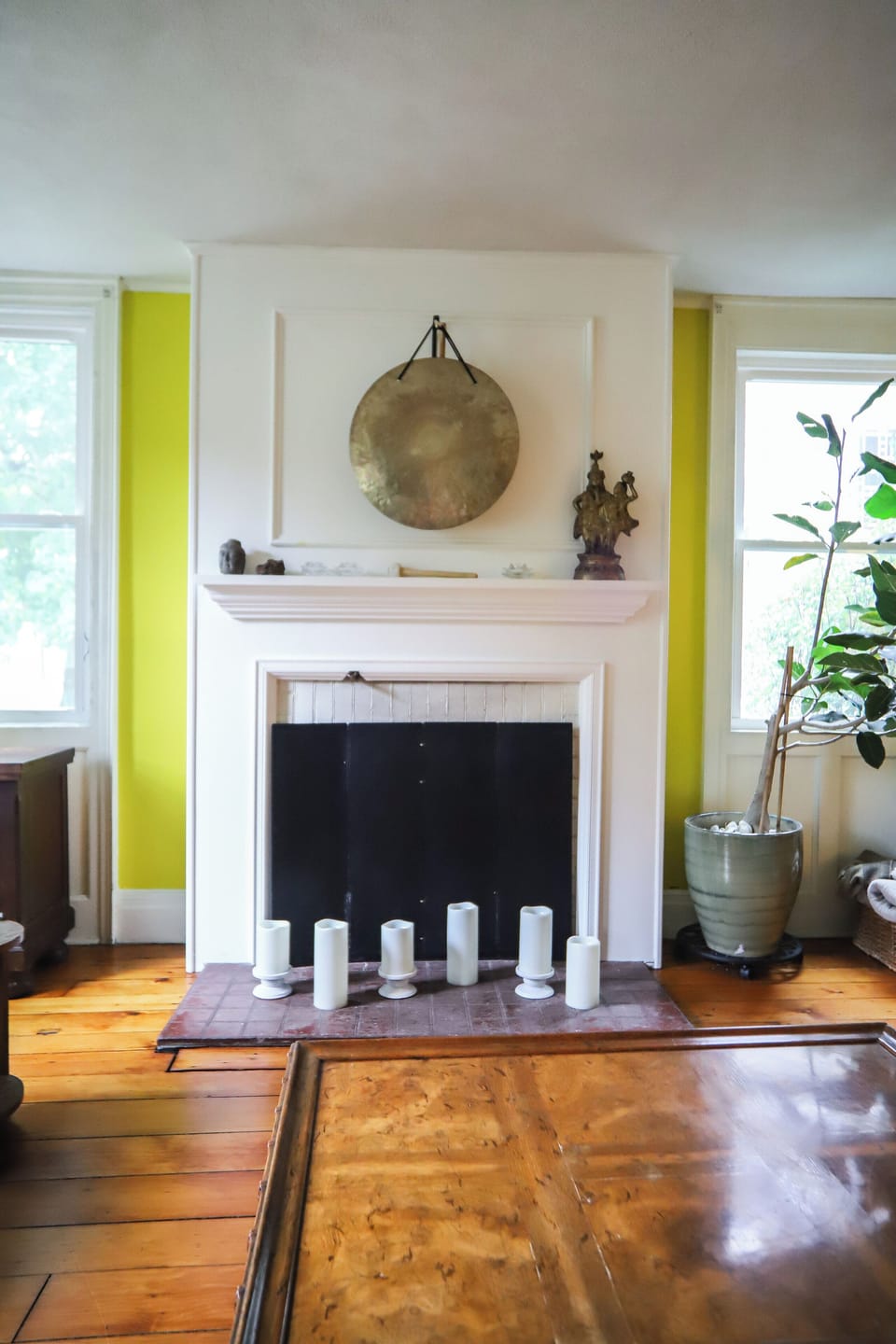 The living room has a decorative fireplace.
