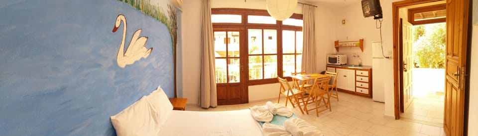 Apartment, 2 Bedrooms, Garden View | Egyptian cotton sheets, in-room safe, desk, iron/ironing board