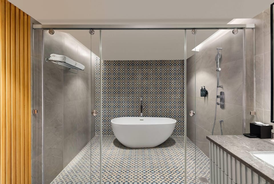 Premium Suite, 1 King Bed, City View | Bathroom | Eco-friendly toiletries, slippers, towels, soap
