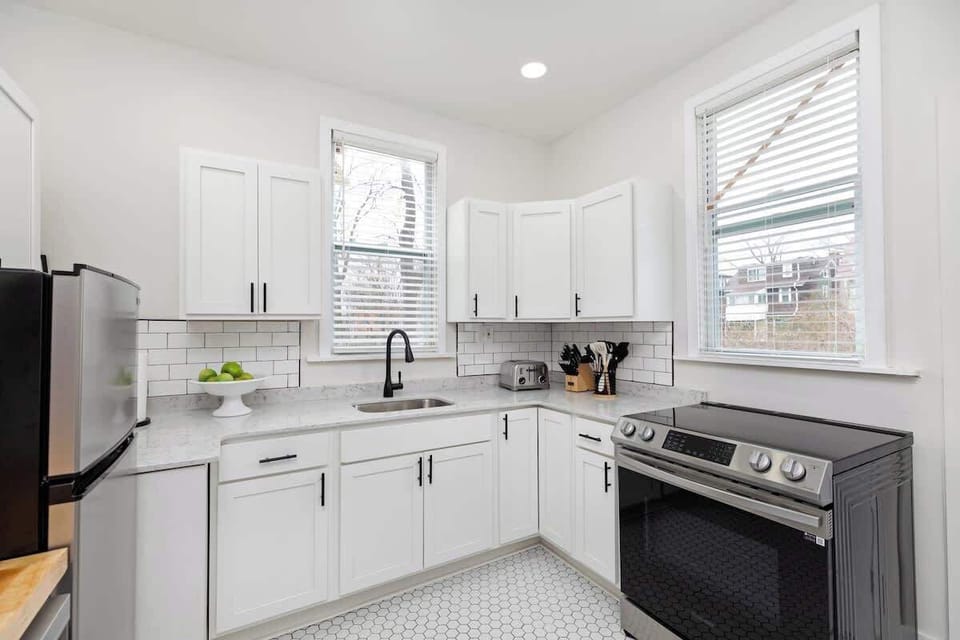 Bright corner kitchen with ample counter space.