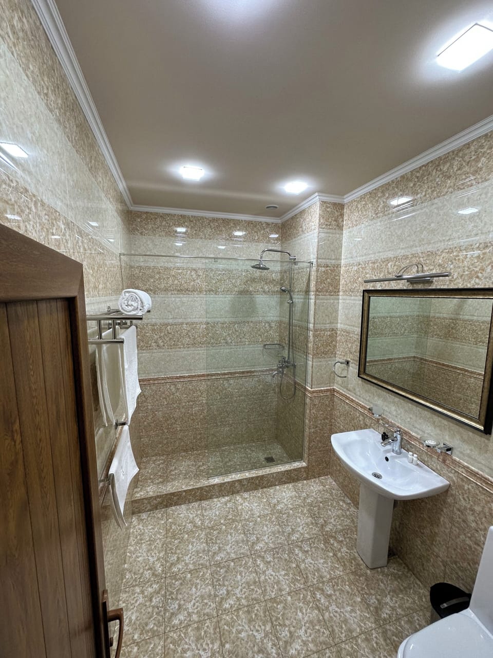 Shower, hair dryer, slippers, towels