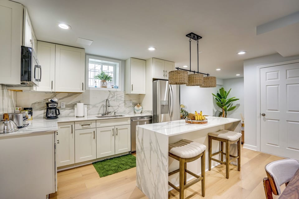 A stylish kitchenette finished with a high-end soft marble