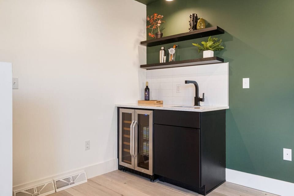 The Green Room wet bar with wine and beverage refrigerator