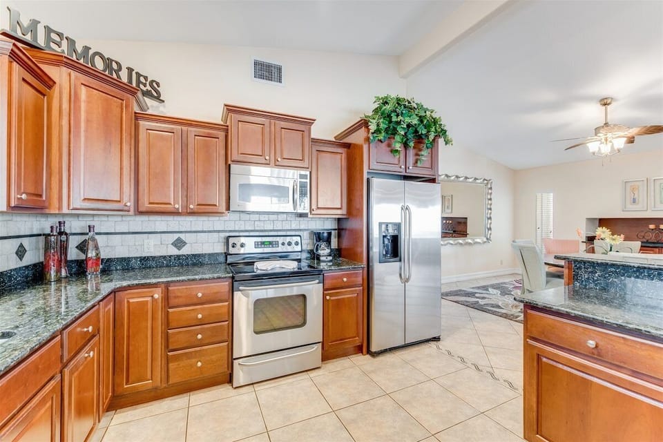 Beautiful stainless steel appliances in this massive kitchen