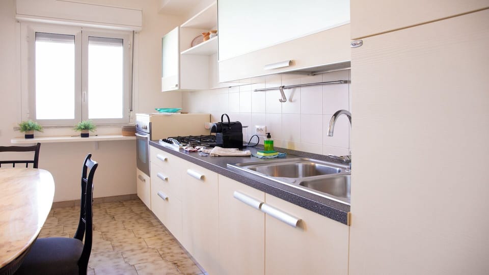 Apartment, Balcony, Sea View | Private kitchen | Electric kettle, toaster, dining tables