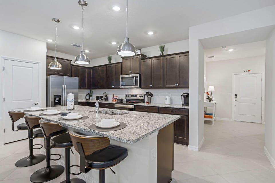 Cook your favorite meals with ease using stainless-steel appliances, granite countertops, and all the essentials.