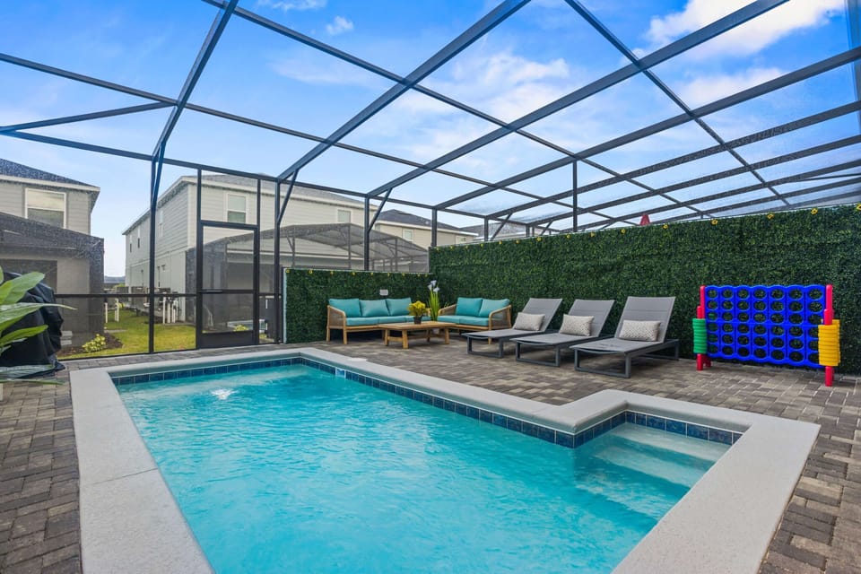Enjoy sunny Florida days in your own private pool surrounded by a clean, open patio — perfect for swimming and lounging in peace.