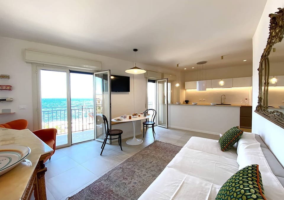Apartment, Sea View | Living area | 32-inch flat-screen TV with cable channels