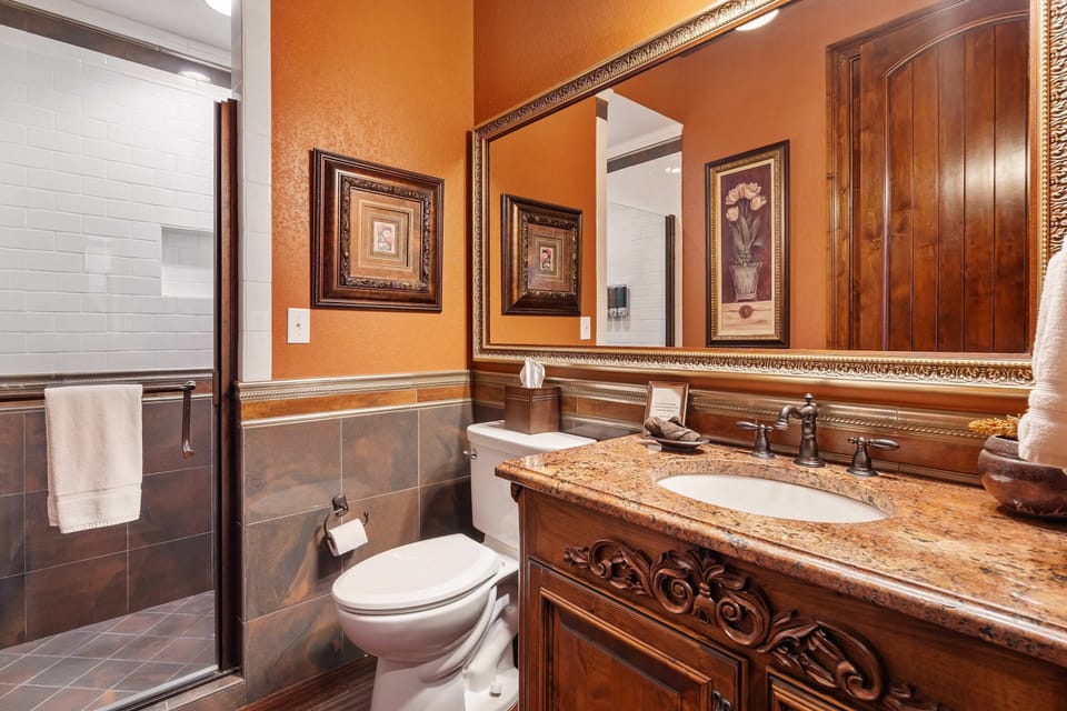 The full guest bath features a single vanity & spacious shower