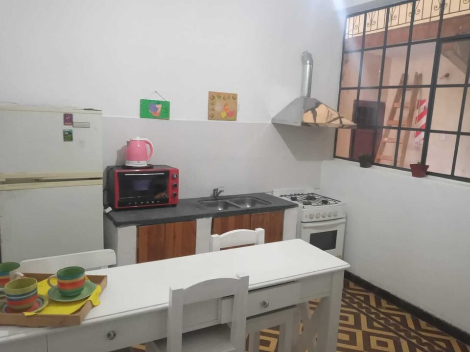 Full-size fridge, oven, stovetop, cookware/dishes/utensils