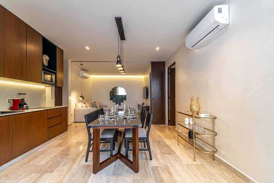 Modern kitchen meets stylish dining area for ultimate comfort and convenience.