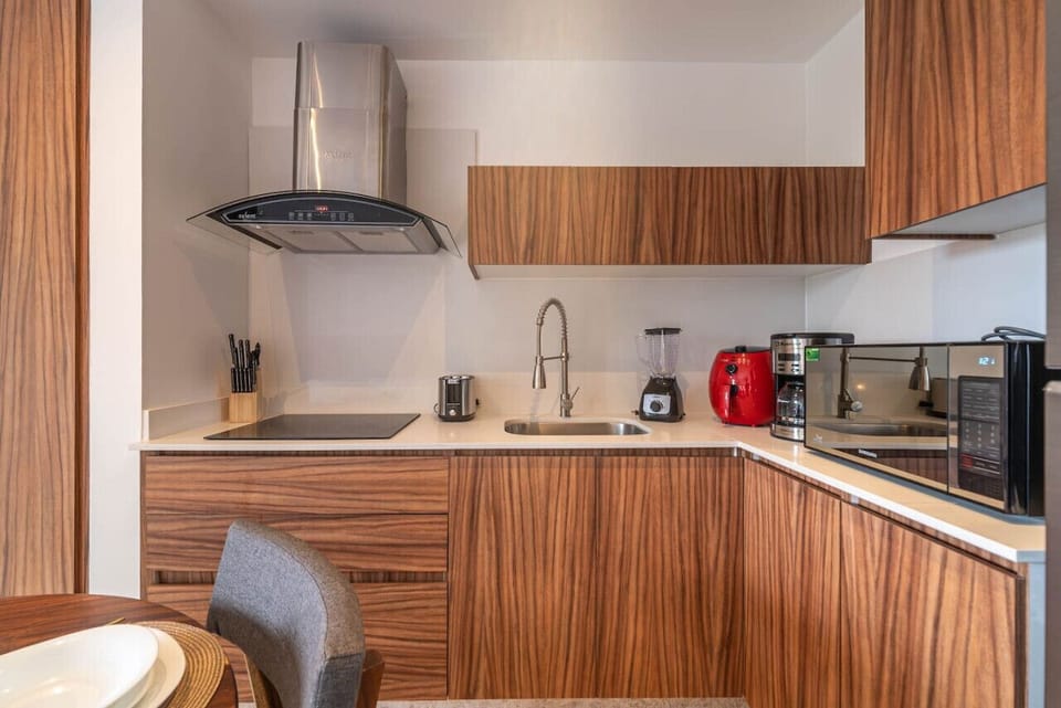 A spacious dining table right across from the kitchen, making meal times easy and enjoyable