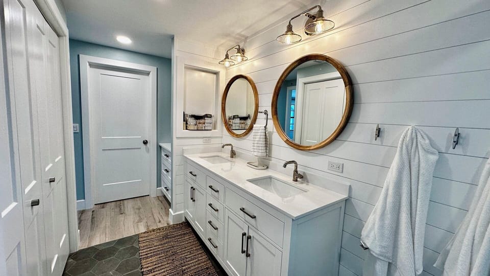 Primary bath; generous walk-in and linen closet spaces.