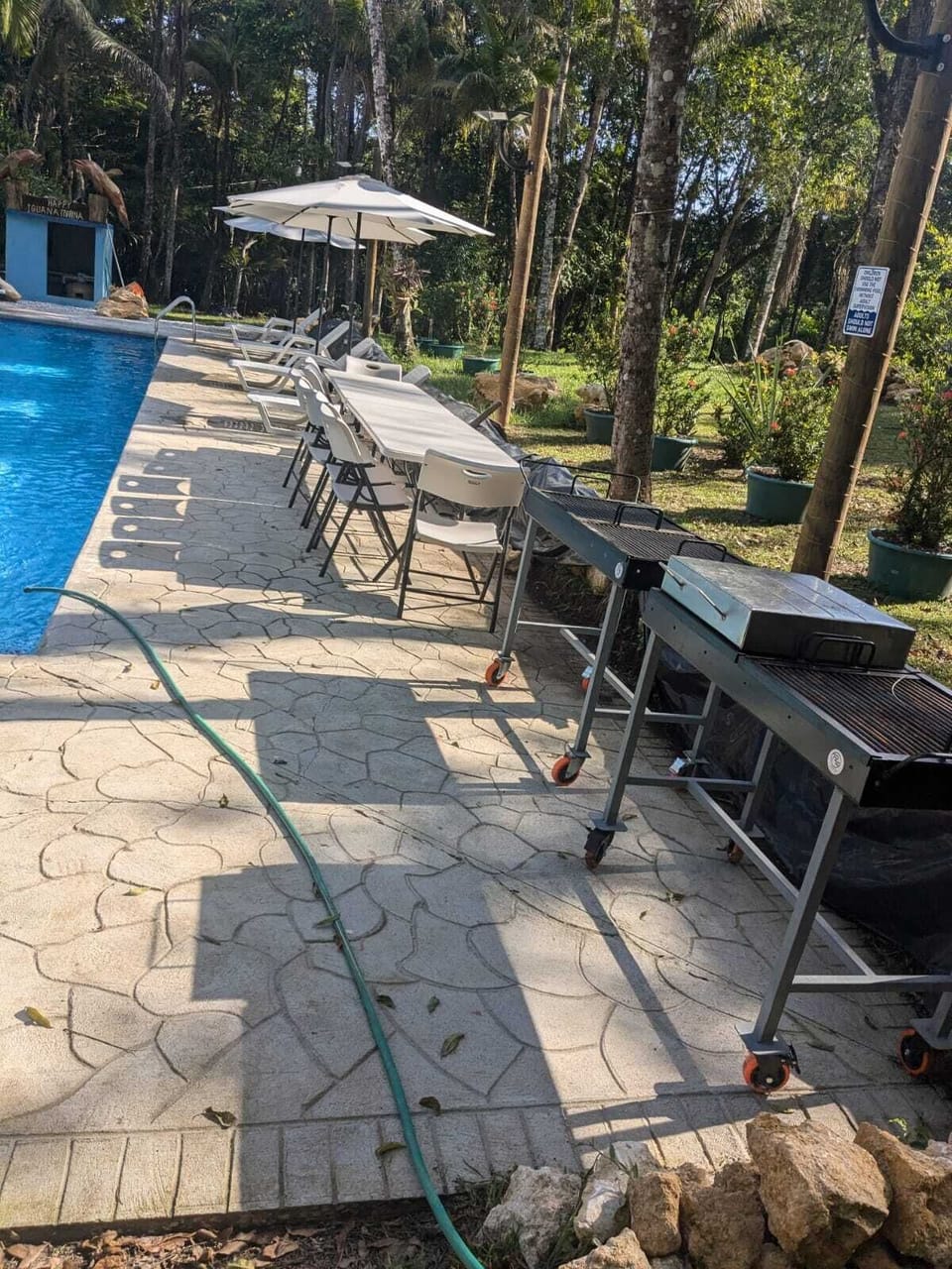 At the pool, there are tables and chairs, grills for you to use.