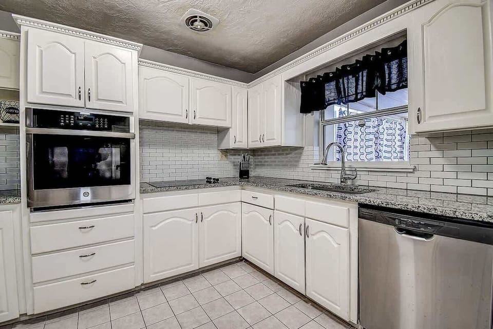 Enjoy cooking in a spacious kitchen, stocked with all the essentials for your culinary needs! #StPetersburg #KitchenGoals #VacationHome