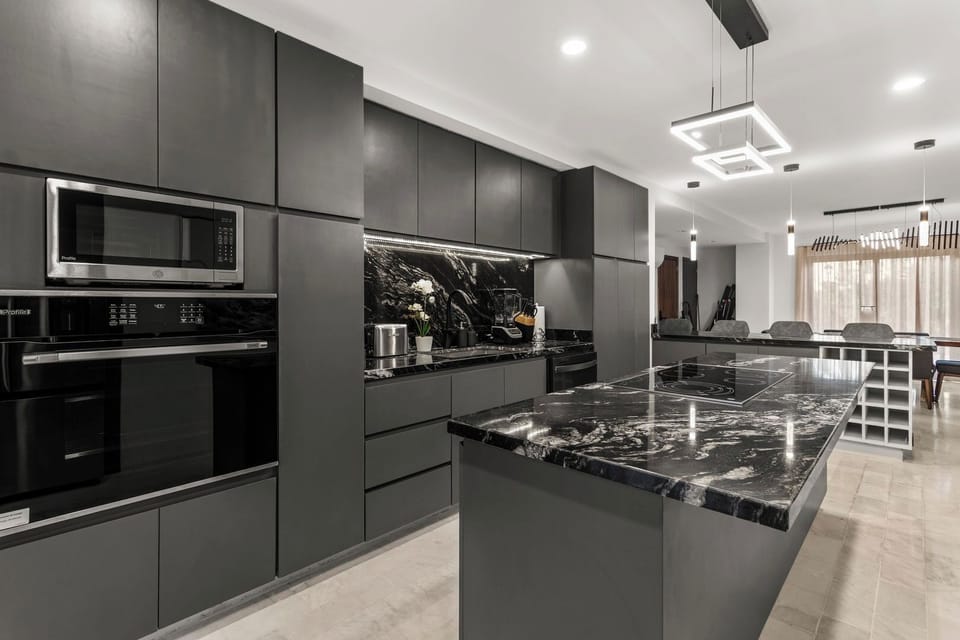 Microwave, Oven, cooktop island and tons of storage space