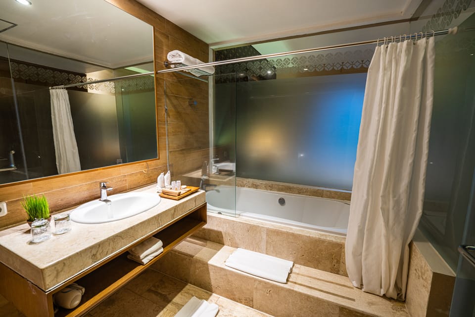 Combined shower/tub, slippers, towels, soap