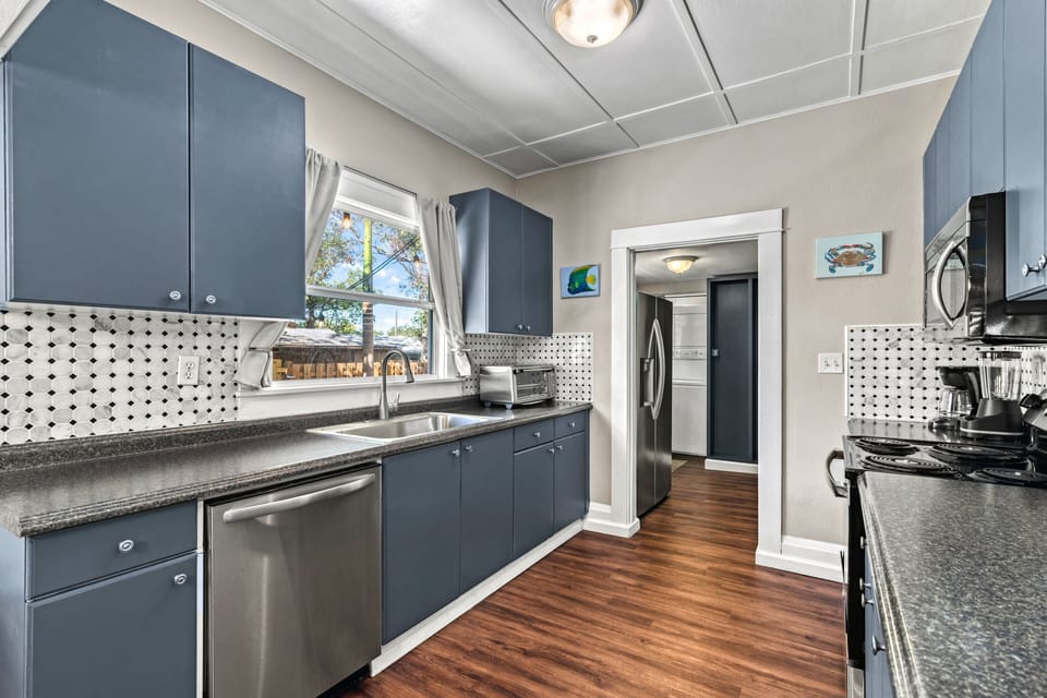 Enjoy the seamless blend of vintage charm and modern appliances in this thoughtfully updated kitchen.