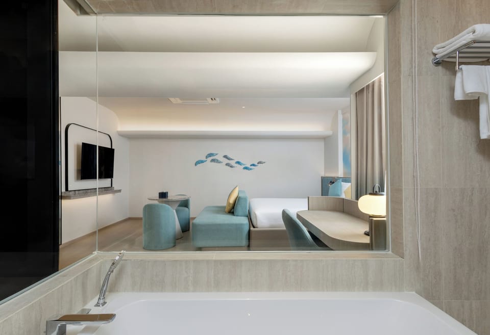 Deluxe Room | Bathroom | Combined shower/tub, deep soaking tub, designer toiletries, hair dryer