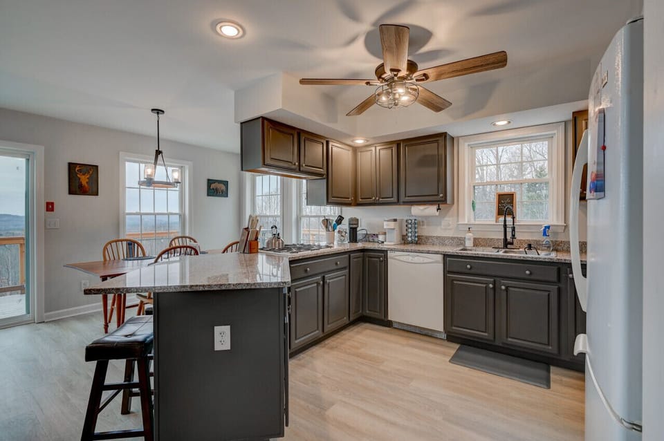Spacious, well-equipped kitchen with everything you need to cook up a great meal—plus stunning views from every angle to enjoy while you prep, cook, or sip your morning coffee.