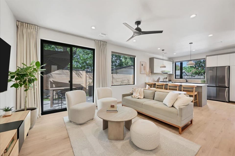 Open Concept Living Room with Kitchen and patio that has table and umbrella. TV, board games and fold out sofa for additional sleeping space!