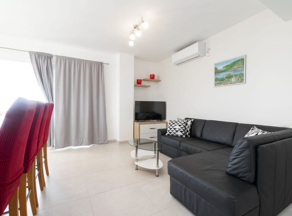 Villa (Modern Villa with Pool) | Living room | 32-inch flat-screen TV with satellite channels