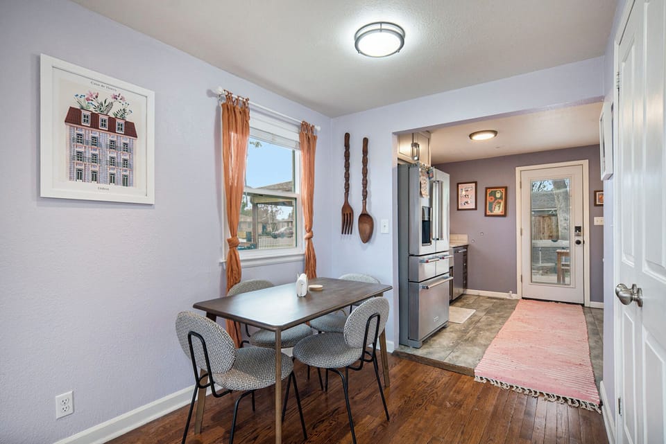 This inviting dining space offers a perfect blend of comfort and charm, ideal for sharing meals and making memories with your group.