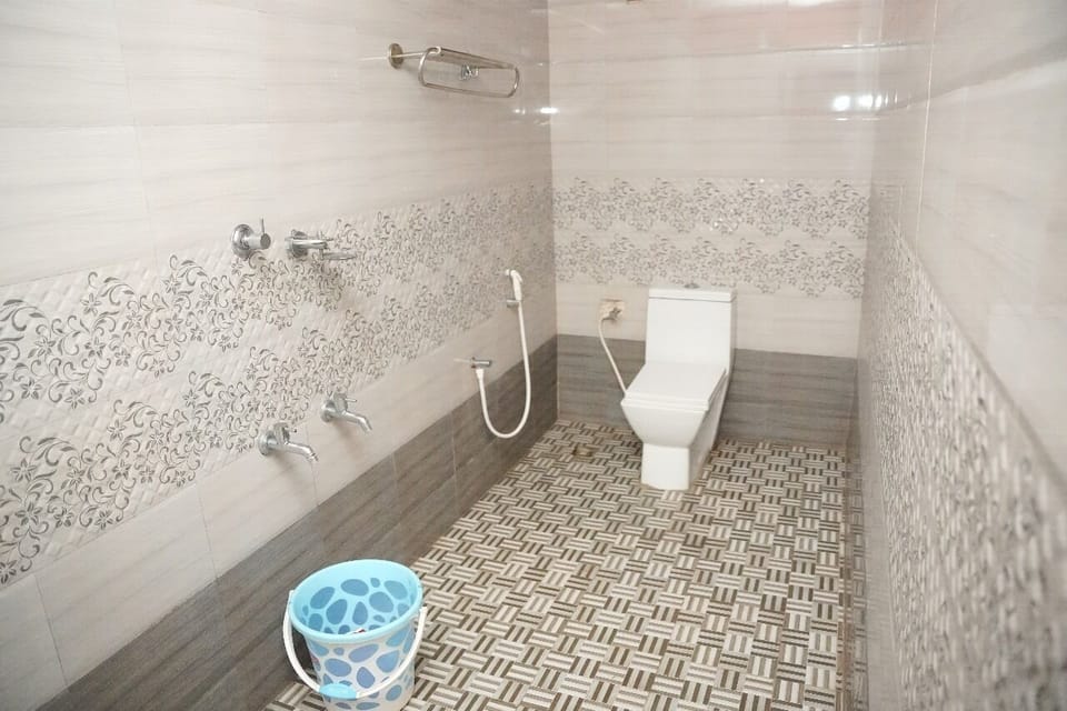 Family Villa, Garden View | Bathroom | Shower, slippers, towels, soap