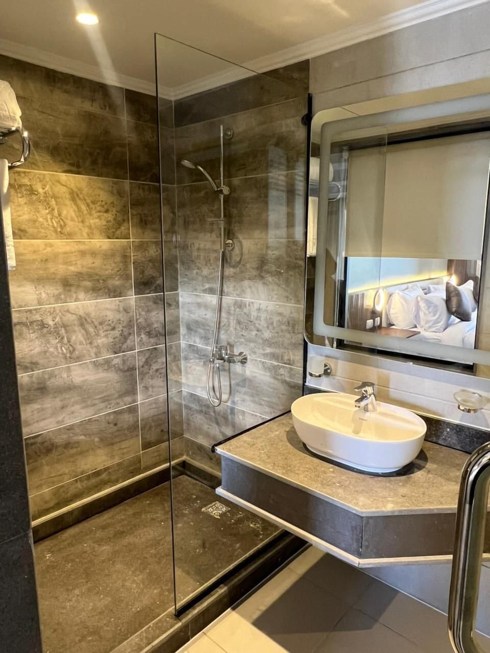 Shower, hair dryer, slippers, towels