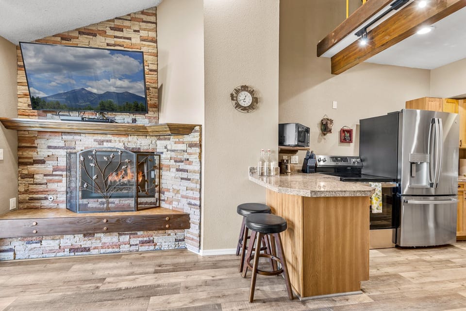 Living room opens up to a fully stocked kitchen
