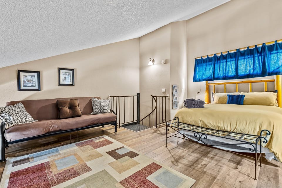 Lofted bedroom at the top of the spiral staircase.