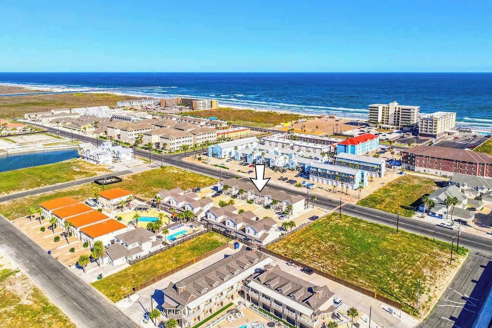 Soak in the coastal vibes with an aerial view of our property, nestled in a neighborhood close to the beach.