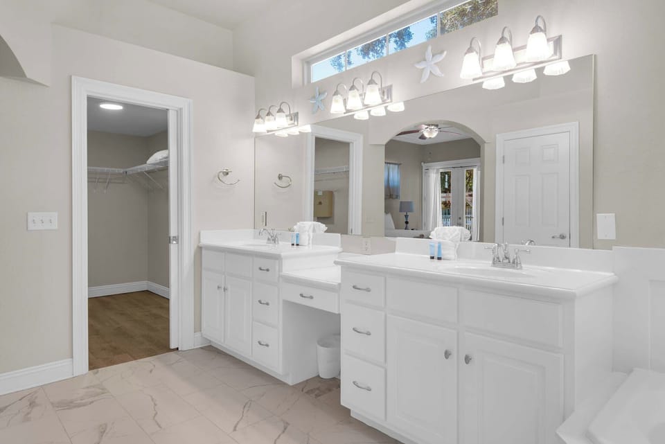 The master bathroom has dual vanities