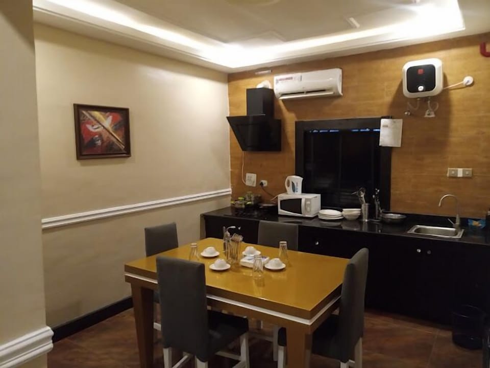Economy Apartment, Balcony, City View | Private kitchen | Fridge, microwave, oven, stovetop