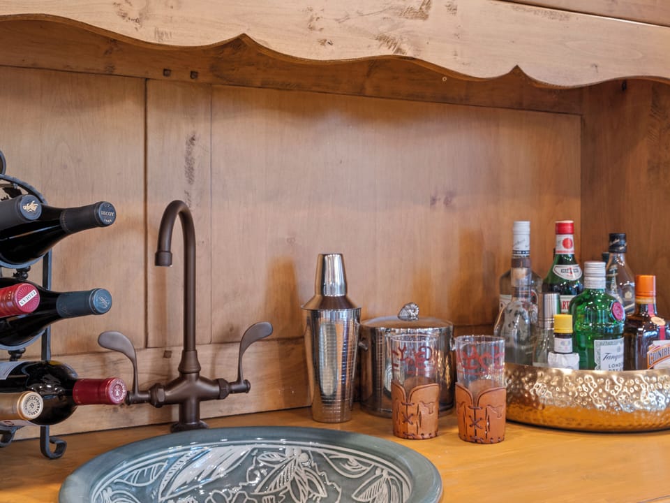 Bar area in the main hallway next to the dining table and great room