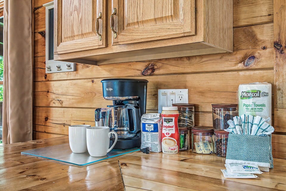 Coffee station in the kitchen has a drip coffee maker and a Keurig.
