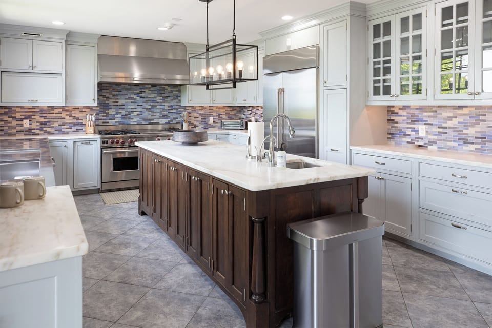 Cook up a feast in our fully equipped, chef-ready kitchen featuring a massive center island and premium appliances.