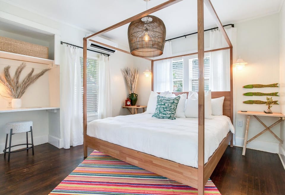 Master bedroom with king bed, television and work area