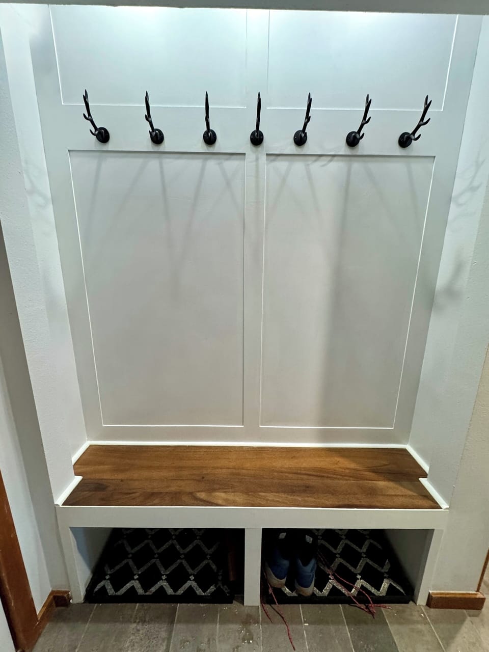 Custom built mud area in the entry w/ boot tray and hooks
