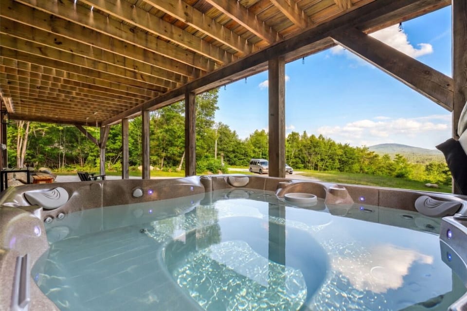 Soak in the luxurious outdoor hot tub after a thrilling day of adventure.