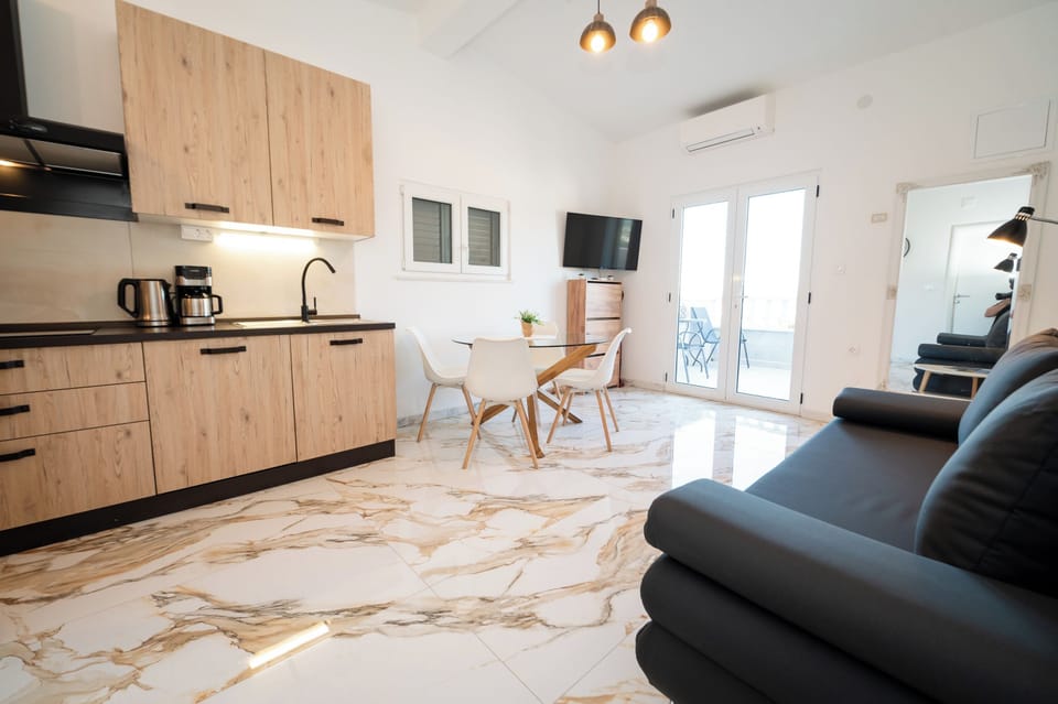 Living room with TV and kitchen