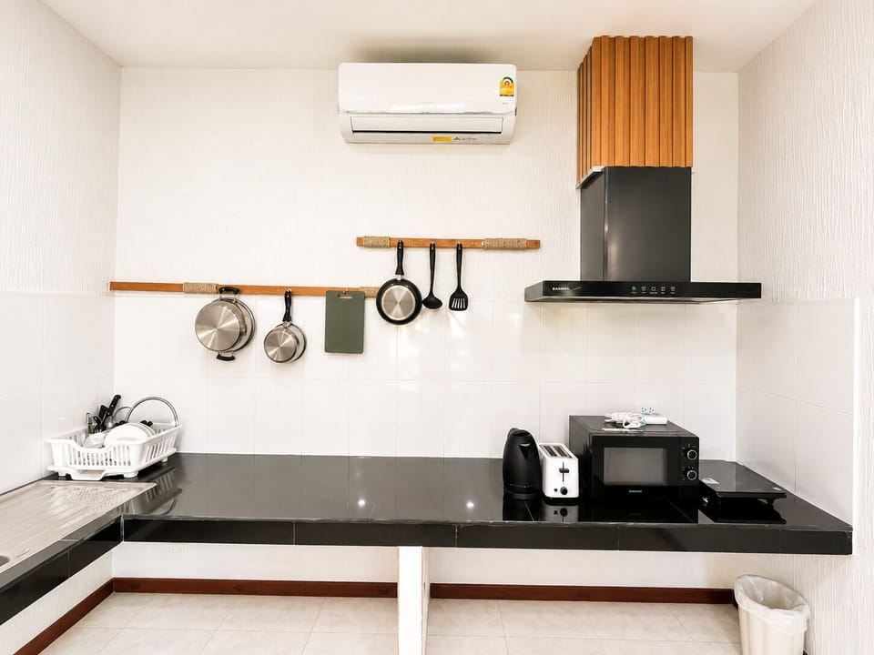 Deluxe Triple Room, Garden View | Private kitchen | Coffee/tea maker, full-size fridge, electric kettle, freezer