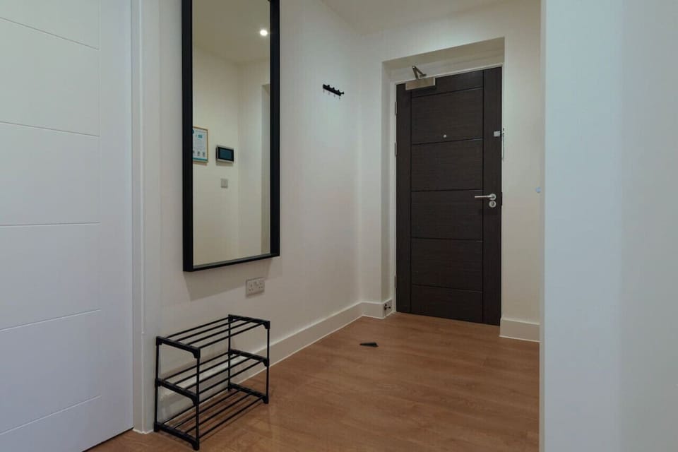 Clean, simple entrance — just drop your bags and settle in