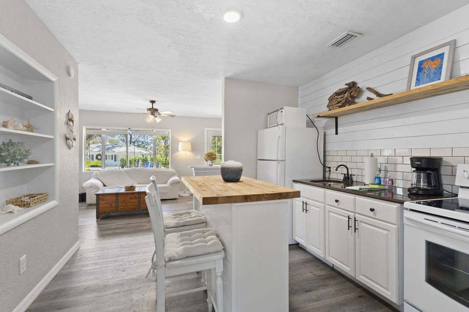 Sit and enjoy meals or snacks at the kitchen island with convenient seating.
