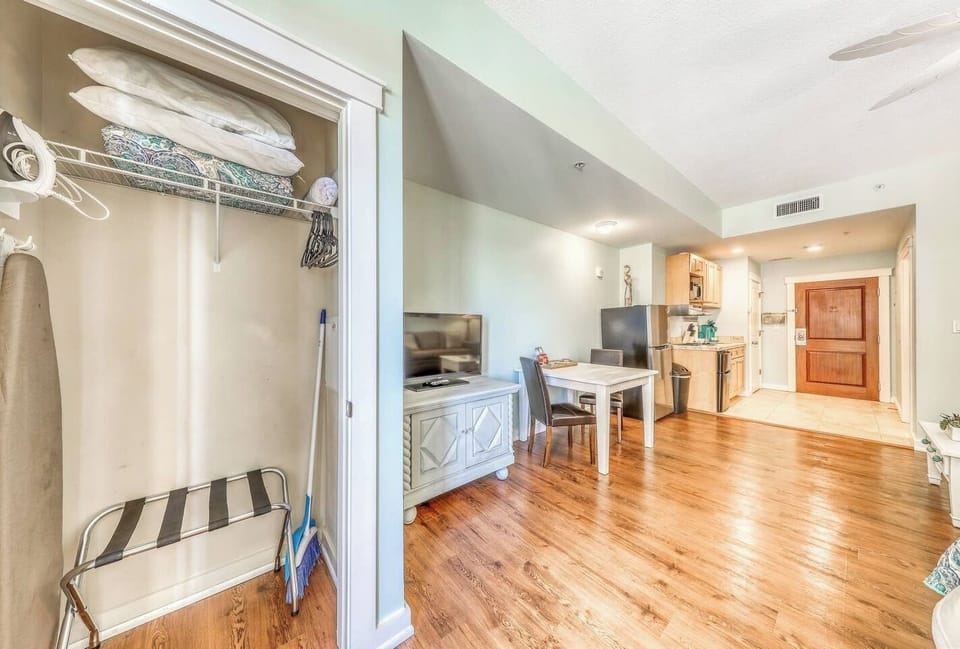 Closet, luggage rack, iron, and ironing board!