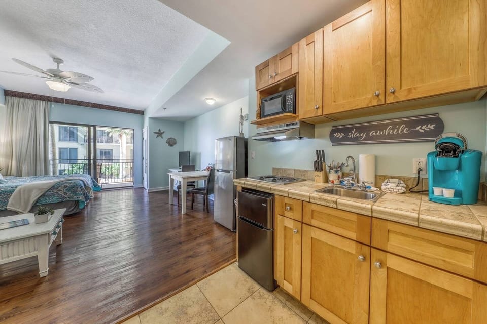 Kitchenette! Perfect for cooking up some quick meals. Mini beverage fridge and a larger fridge for groceries, Keurig and steak knives, microwave, pots, pans, cups. bowls, & utensils!