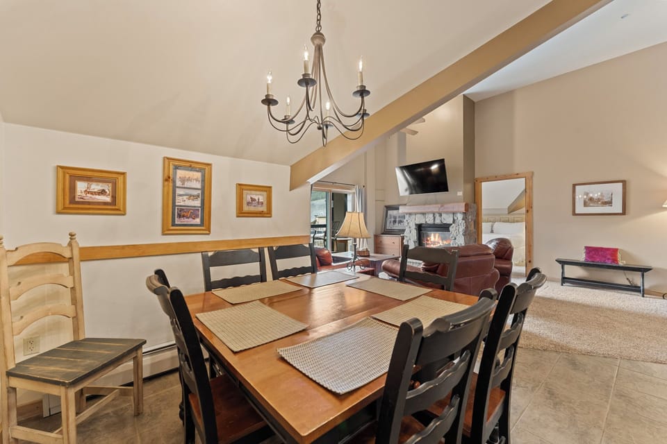 Gather around the elegant dining table for memorable meals with loved ones in this warm, beautifully appointed space.